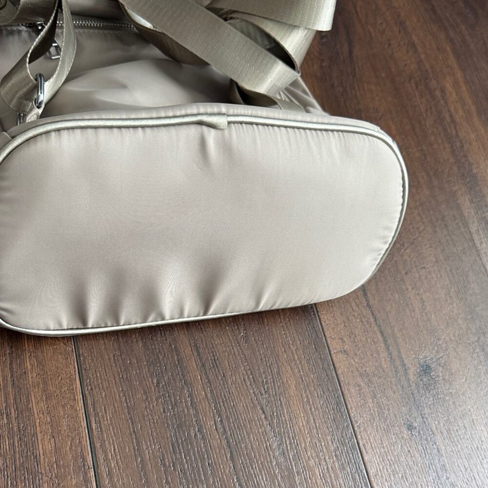 Neutral Taupe Woman’s Backpack with Metallic Accent and many zipper pockets. - Picture 4 of 13